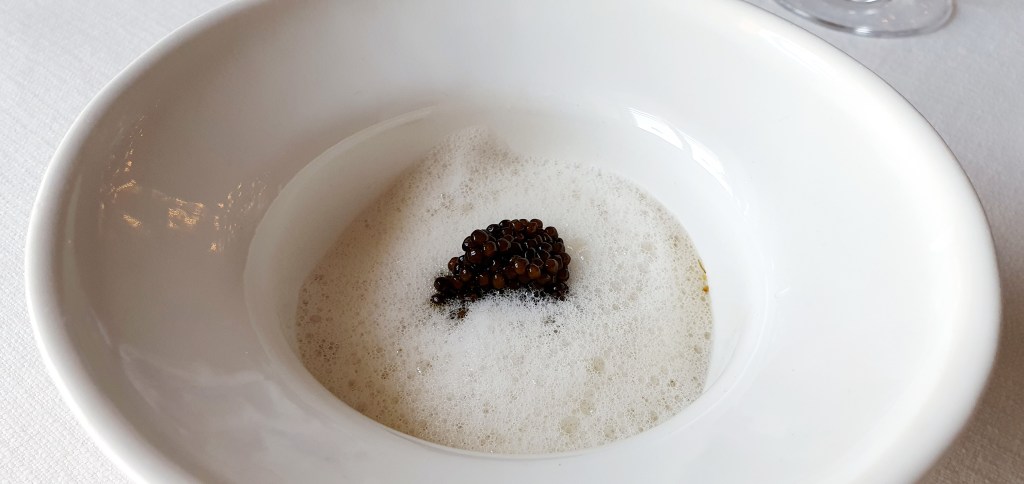 Kaviar with oyster, green strawberries