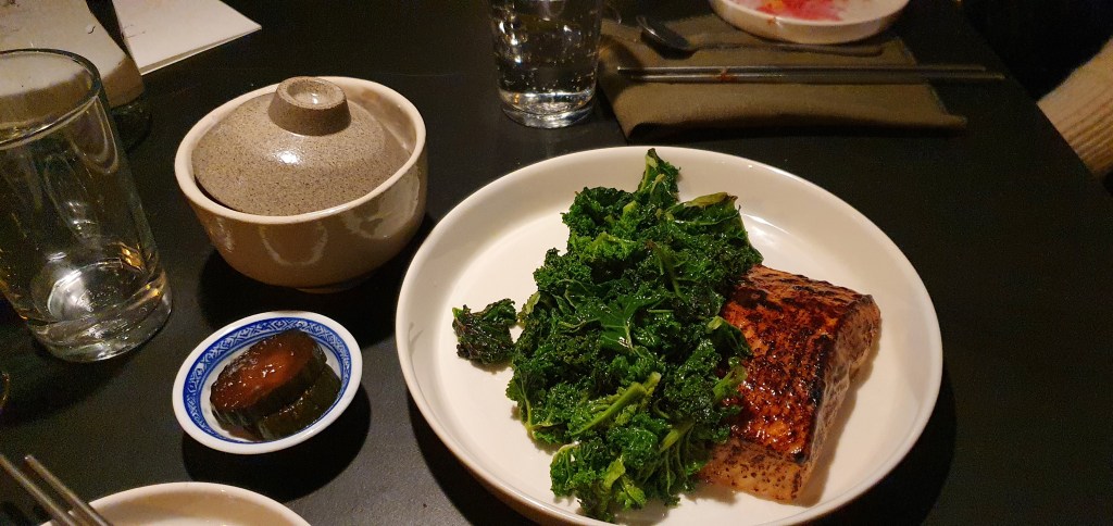 Salmon with kale and rice, fermented cucumber